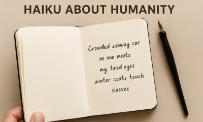Handwritten haiku about humanity in a notebook, expressing human emotion through simple poetry