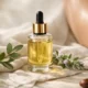 Luxury fur oil in a glass dropper bottle displayed on soft linen with natural botanicals, highlighting clean intimate skincare and ingrown hair prevention